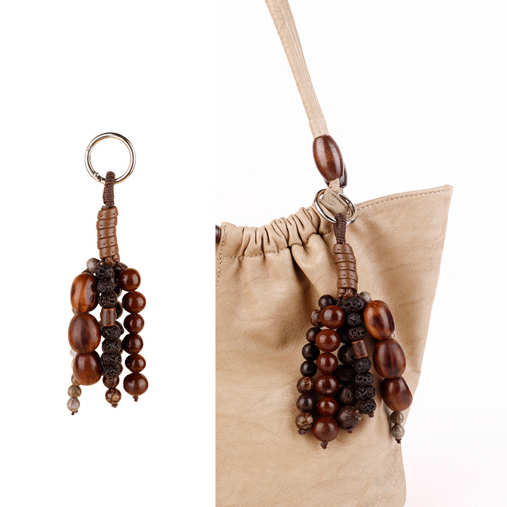 Natural fruit shell detail paired with wooden beads