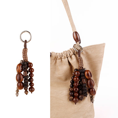 Natural fruit shell detail paired with wooden beads
