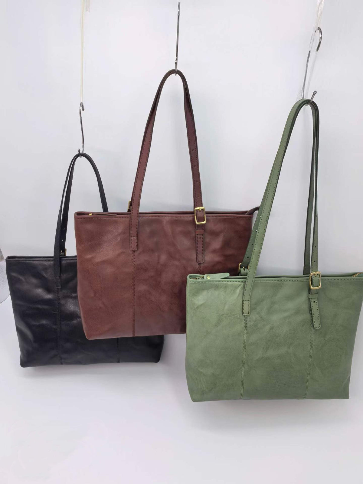 Roomy business tote with an adjustable strap for hands-free travel across town.