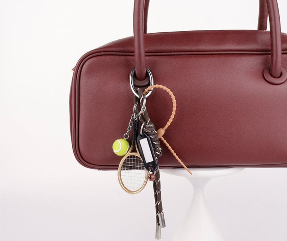 Playful woven phone charm for everyday carry