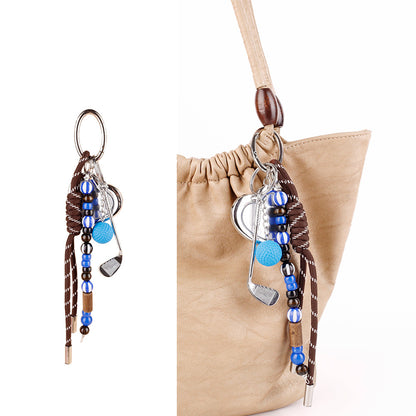 Natural wood bead detail on a handmade woven charm