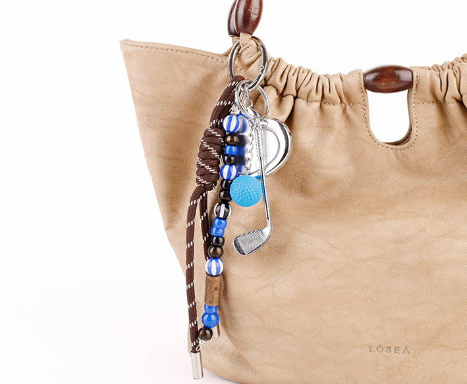 Wood bead keychain charm with a textured woven design