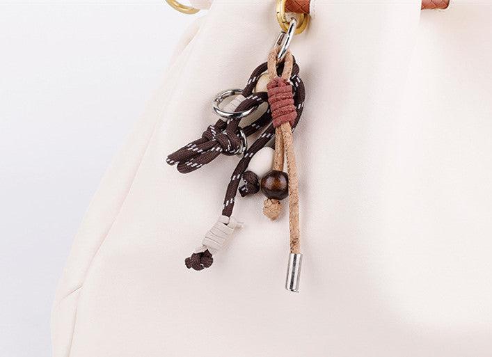 Handmade pendant shown as a small gift for a bag lover