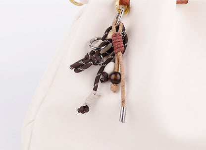 Handmade pendant shown as a small gift for a bag lover