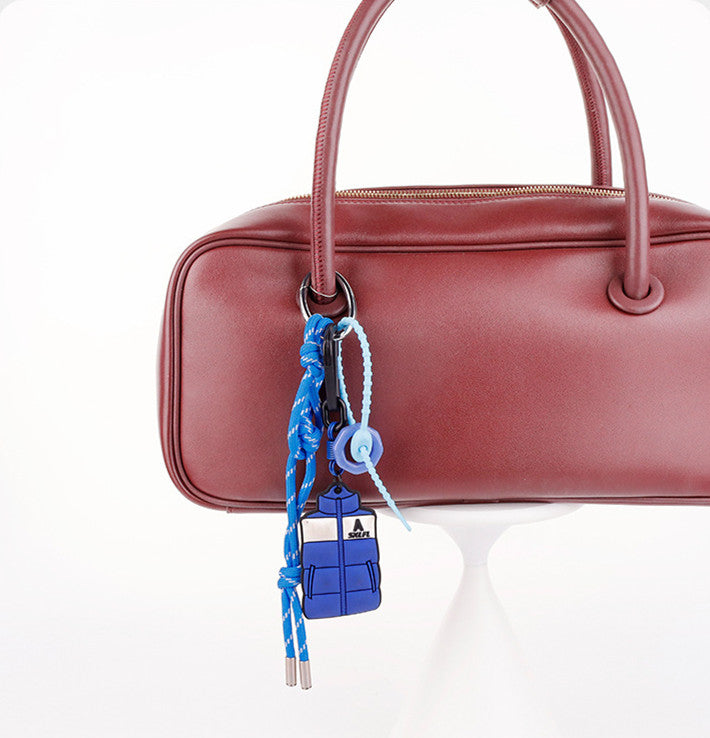 Rope keychain charm styled with an everyday canvas bag