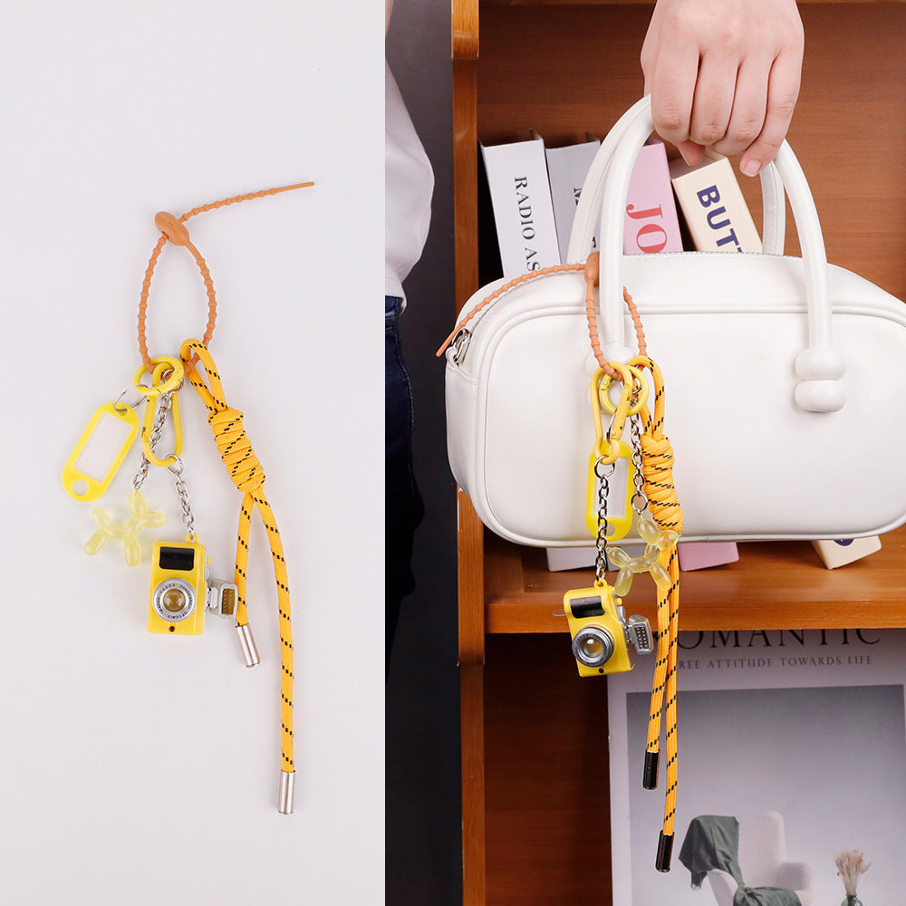 Yellow sporty accessory pendant gifted to a sister for her handbag collection