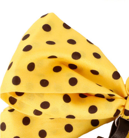 Handmade tassel accessory with yellow scarf bow
