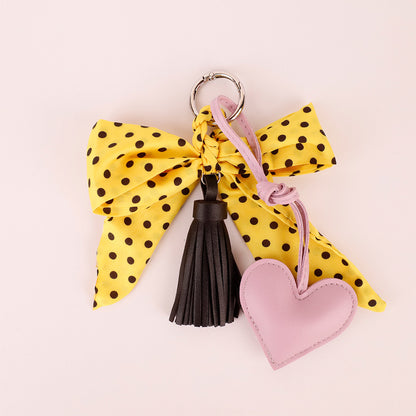 Handmade bow and tassel decoration in yellow