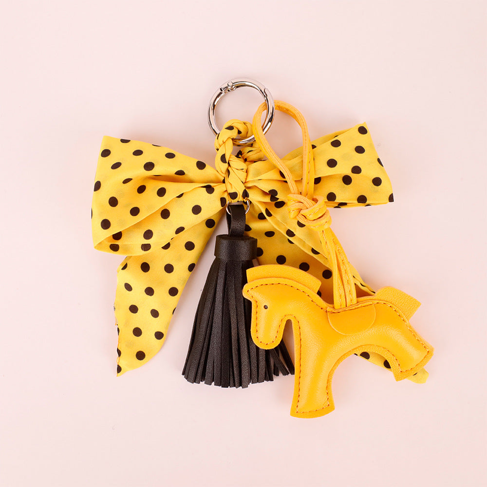 Handmade yellow tassel charm with scarf bow