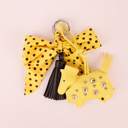 Yellow charm for adding a playful touch to a tote