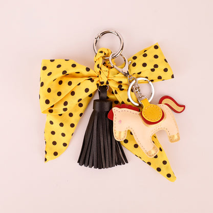 Handmade yellow bow decoration for bags and keys