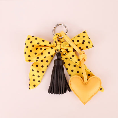 Handmade scarf bow accessory with yellow polka dots