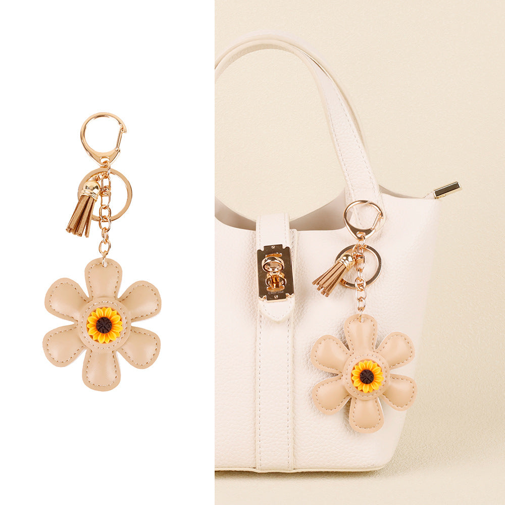 Sunflower accessory with tassel detail for casual bags