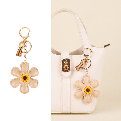 Sunflower accessory with tassel detail for casual bags