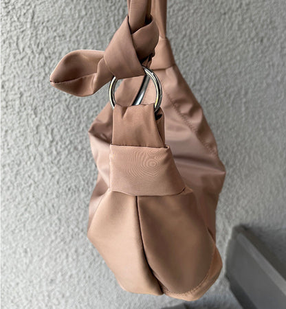 Women’s travel sling for keeping belongings within reach