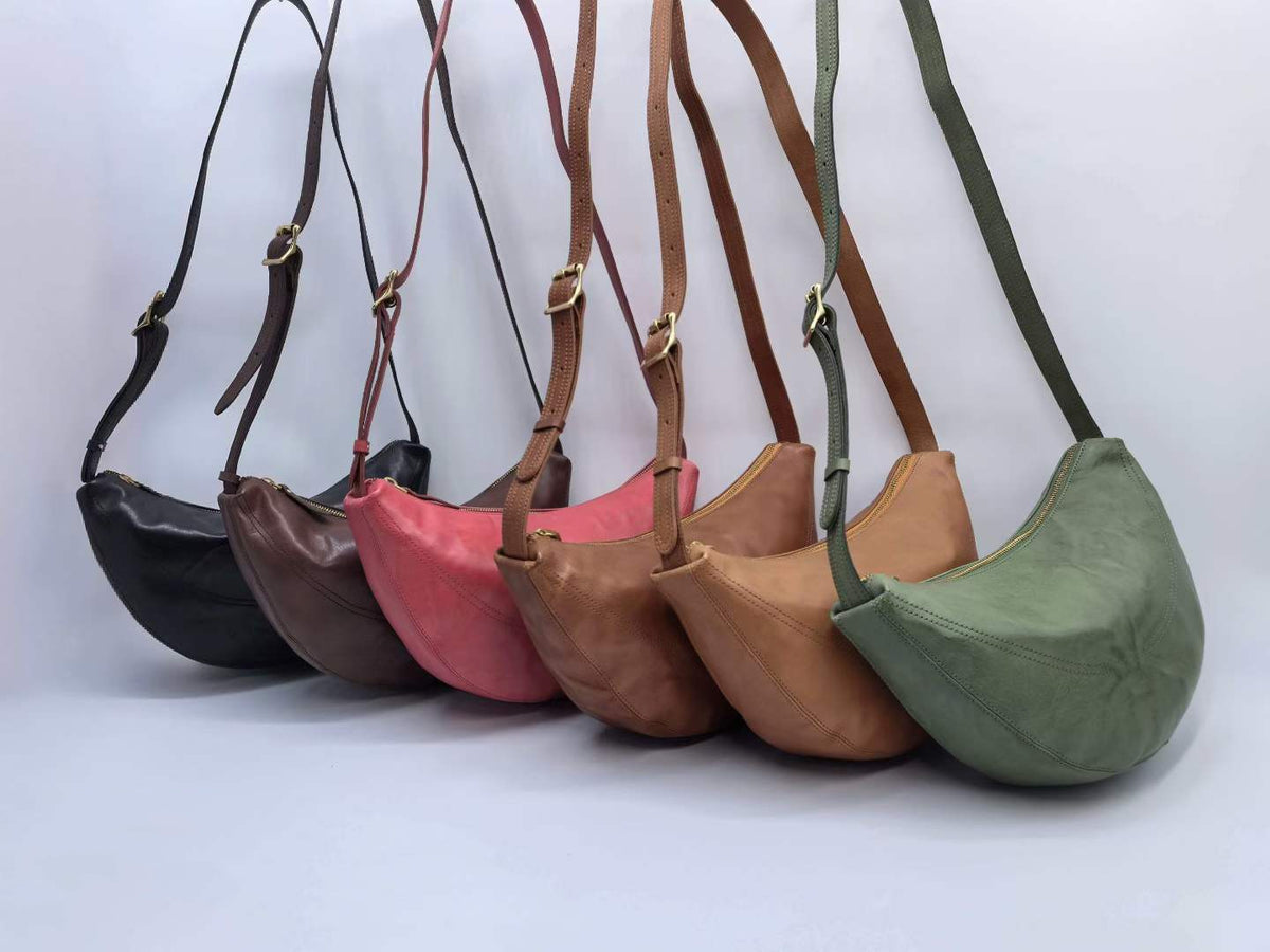 Crescent-shaped shoulder bag with gold-tone hardware for casual outfits