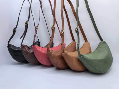 Crescent-shaped shoulder bag with gold-tone hardware for casual outfits